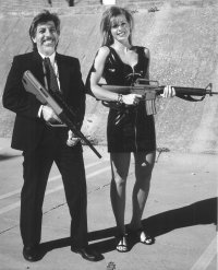 Ken and a lady friend enjoying holding some big guns