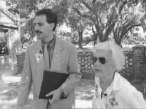 Borat and Jane have a closer look to see if the 'cow milker' is a boy or a girl.