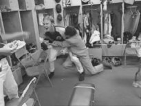 Borat and a player have a friendly wrestle.