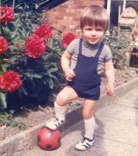 A young Hamil learning to play football